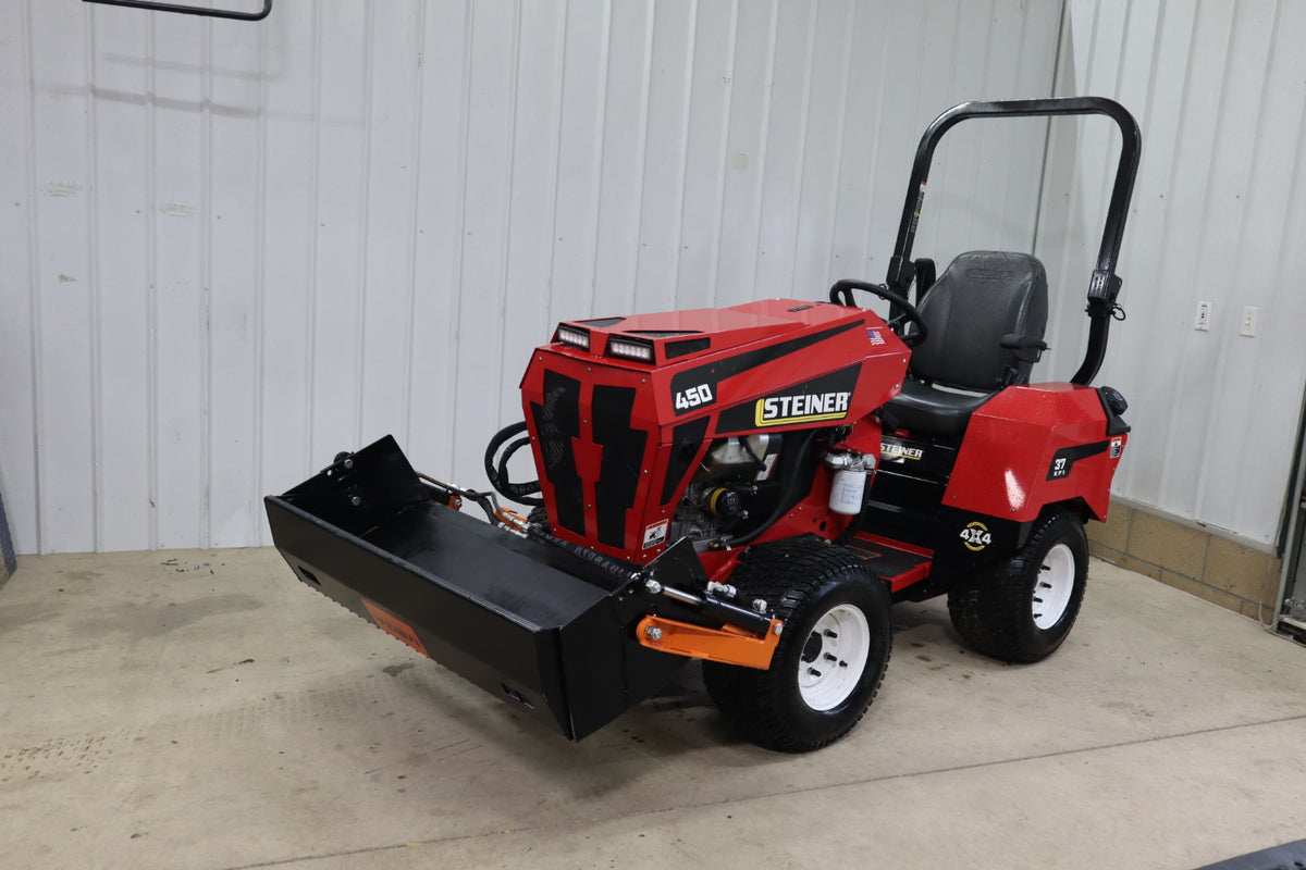 Bobcat AT450 with Mega Multi‑Purpose Bucket in use